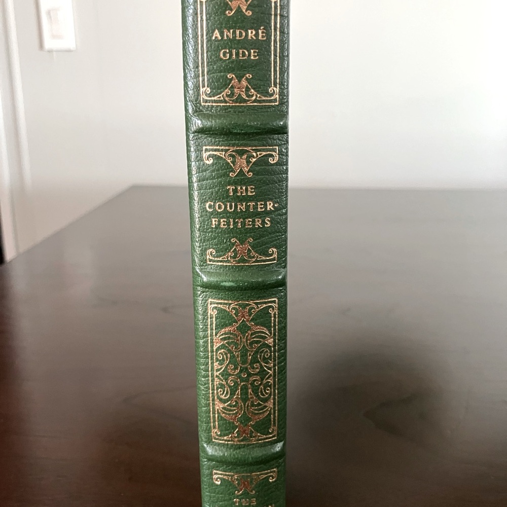 The Franklin Library leather band book . The Counterfeiters by Andre Gide.